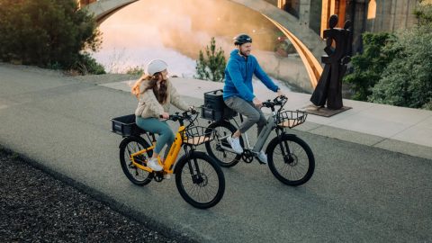 a man and a woman riding bikes
