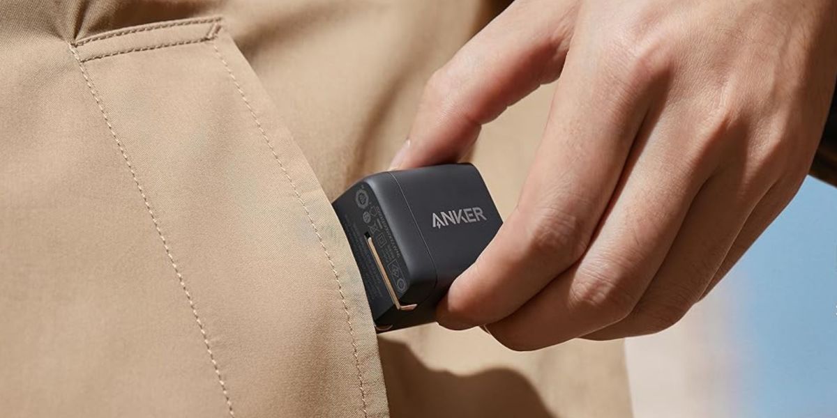 Image showing a person putting Anker's USB-C charger in their pocket.