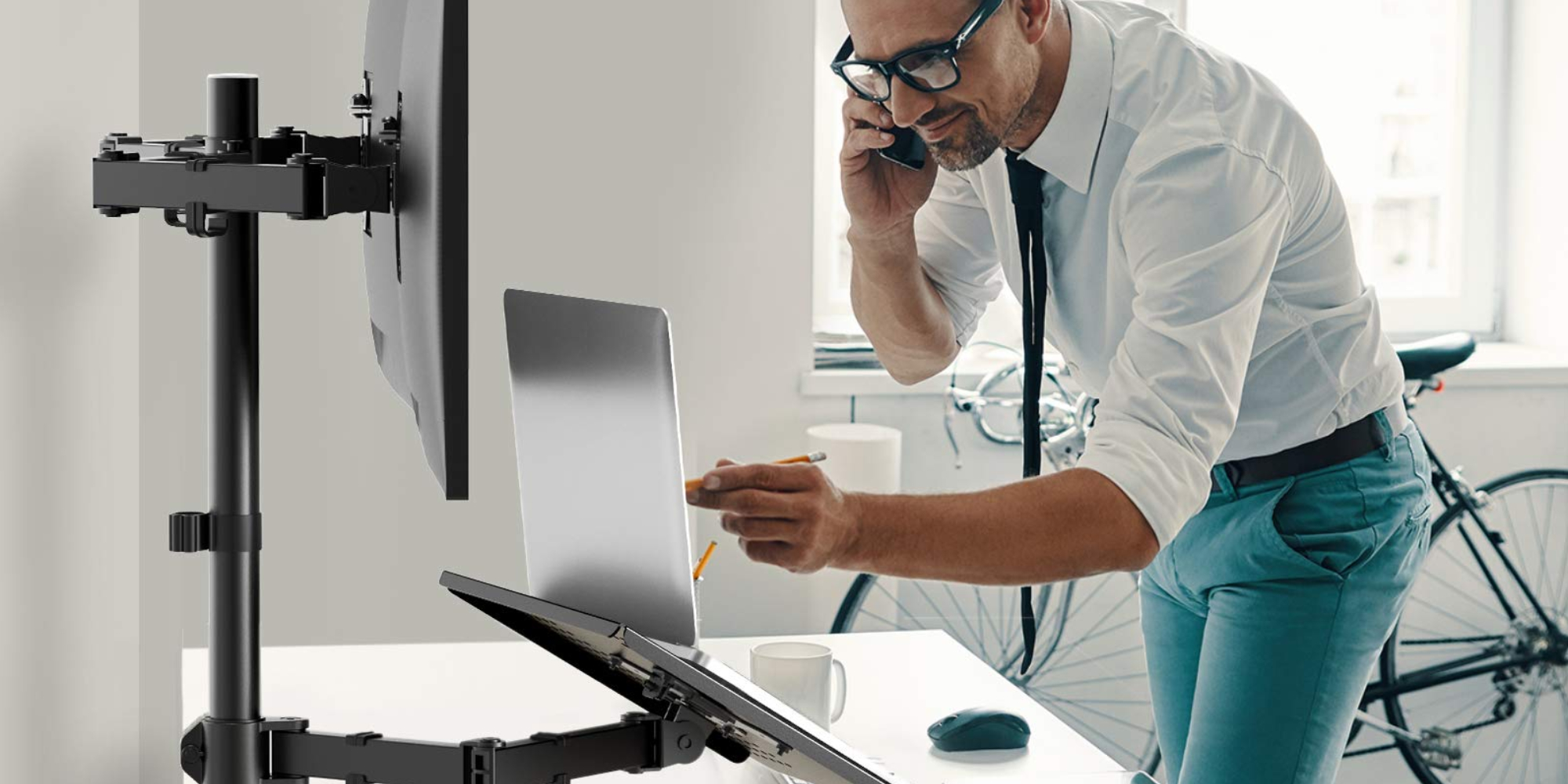 This dual monitor and laptop desk mount streamlines it all in one go