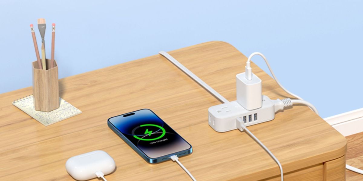 Image showing a power strip charging an iPhone and AirPods.