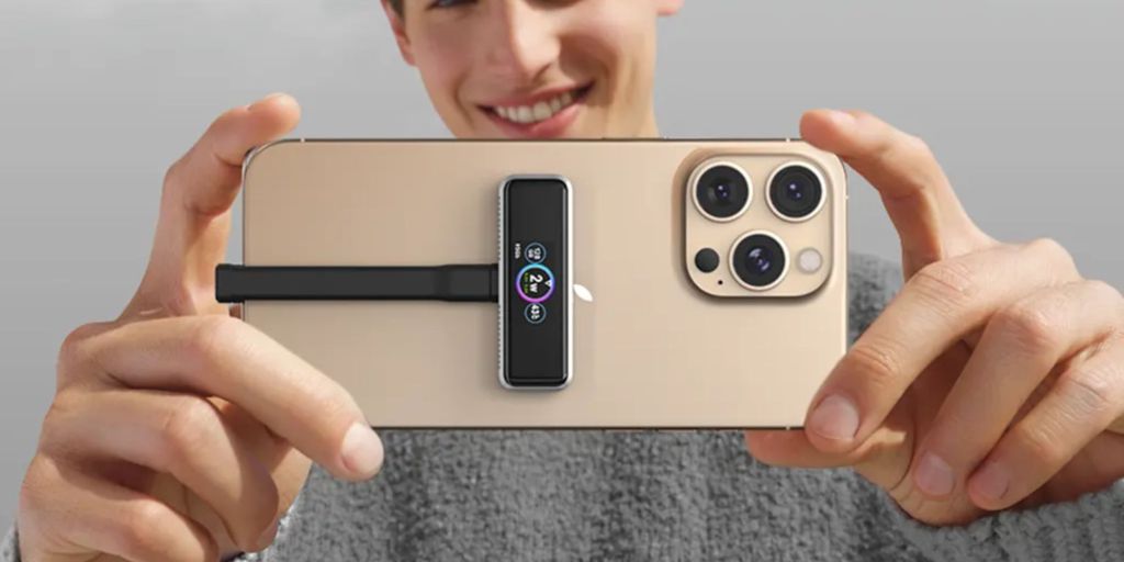 Image showing a person holding an iPhone with Zike magnetic extended storage.