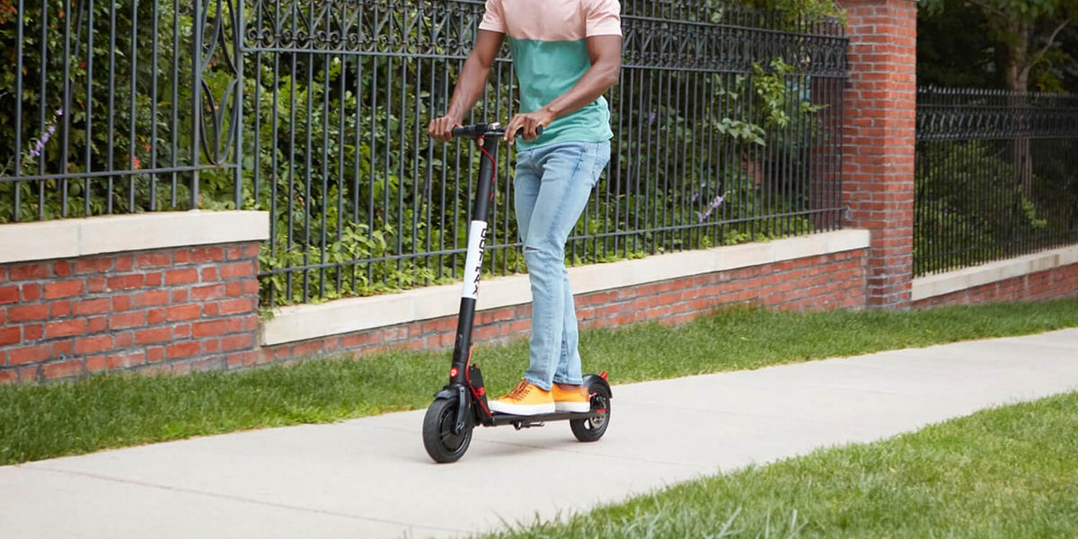 a man riding a scooter