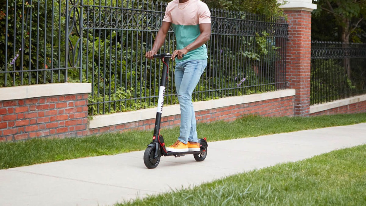 a man riding a scooter