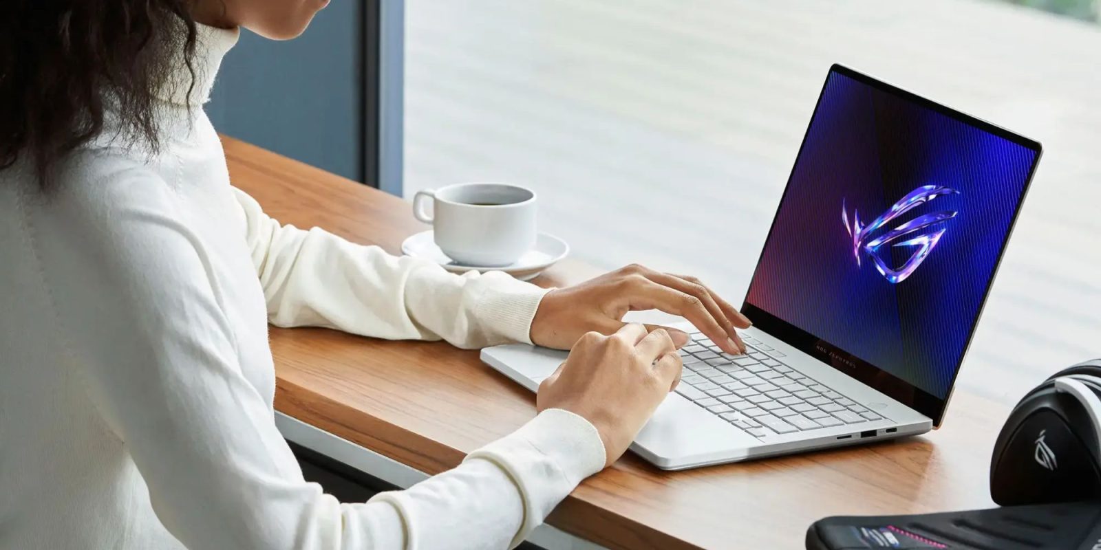 Image showing a person using ASUS' ROG Zephyrus G14 gaming laptop.