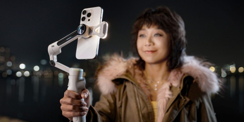 Image showing a person holding Insta360's Flow 2 Pro gimbal.