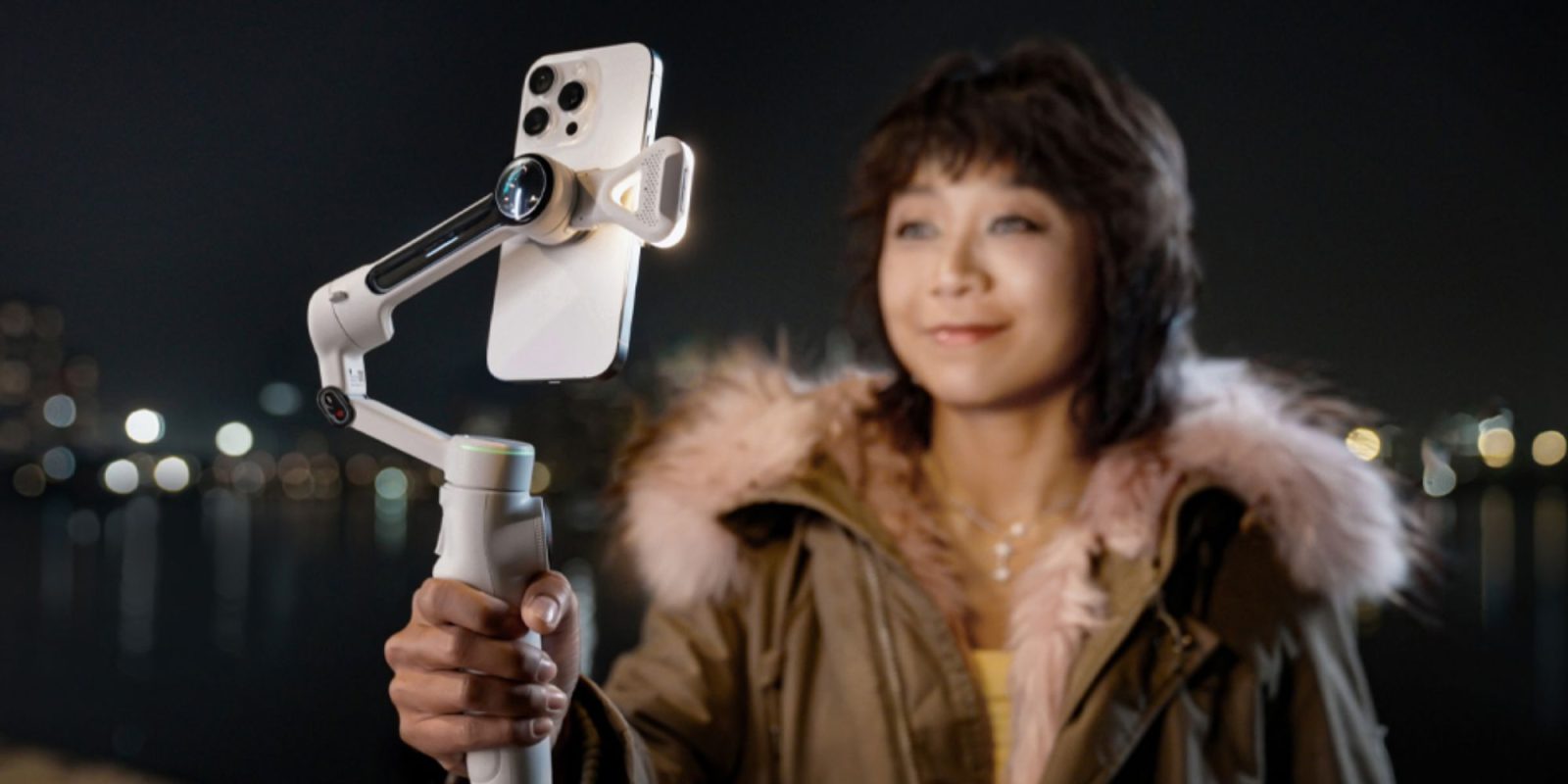 Image showing a person holding Insta360's Flow 2 Pro gimbal.