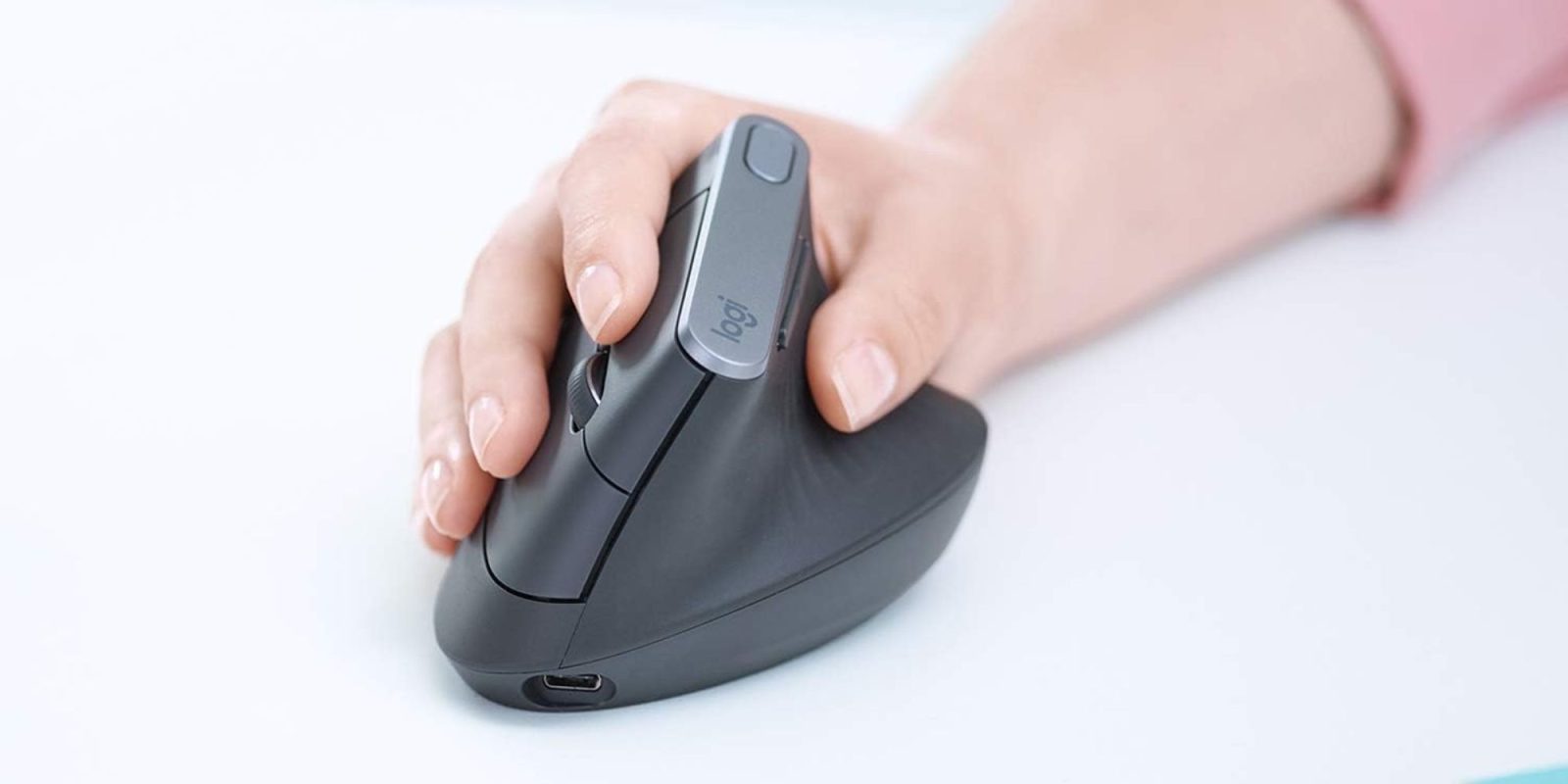 Image showing a person holding Logitech's MX Vertical mouse.