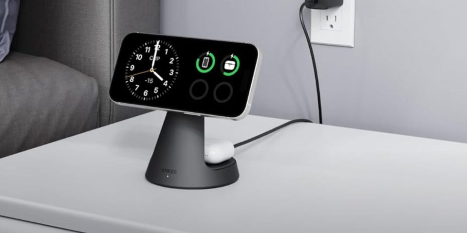 A smart phone charging on a charging station