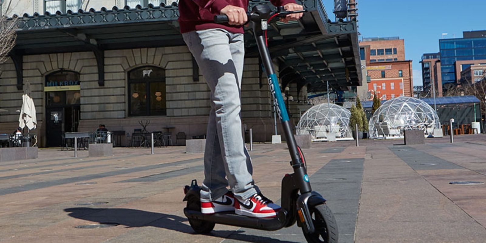 A person riding a scooter