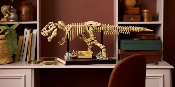 A toy dinosaur on a shelf