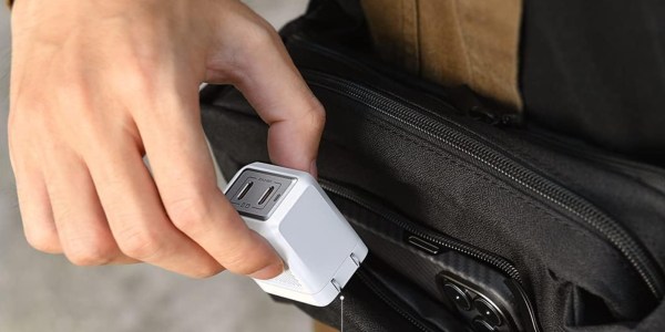 A hand holding a usb device