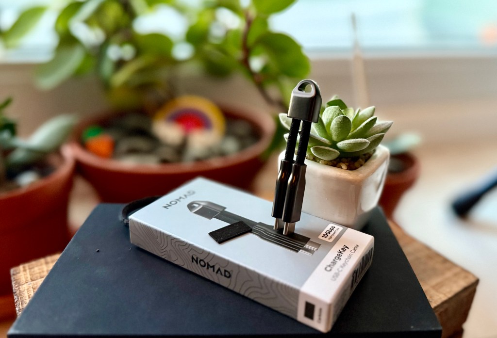 A small box with a keychain attached to it