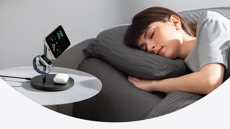 A woman sleeping in bed with a smart watch