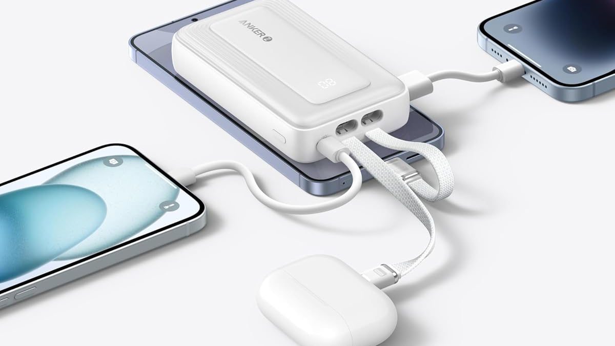 A white device connected to a cell phone