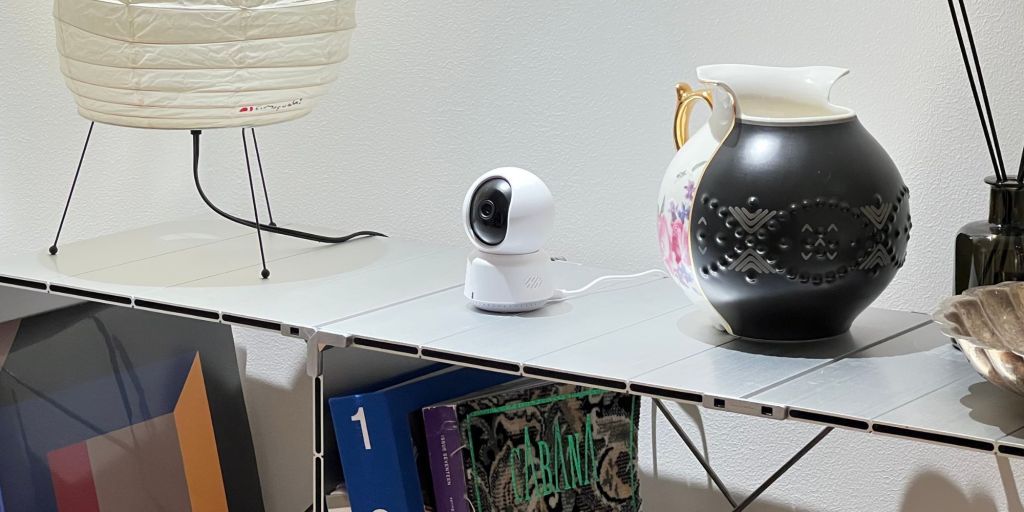 A white camera on a table