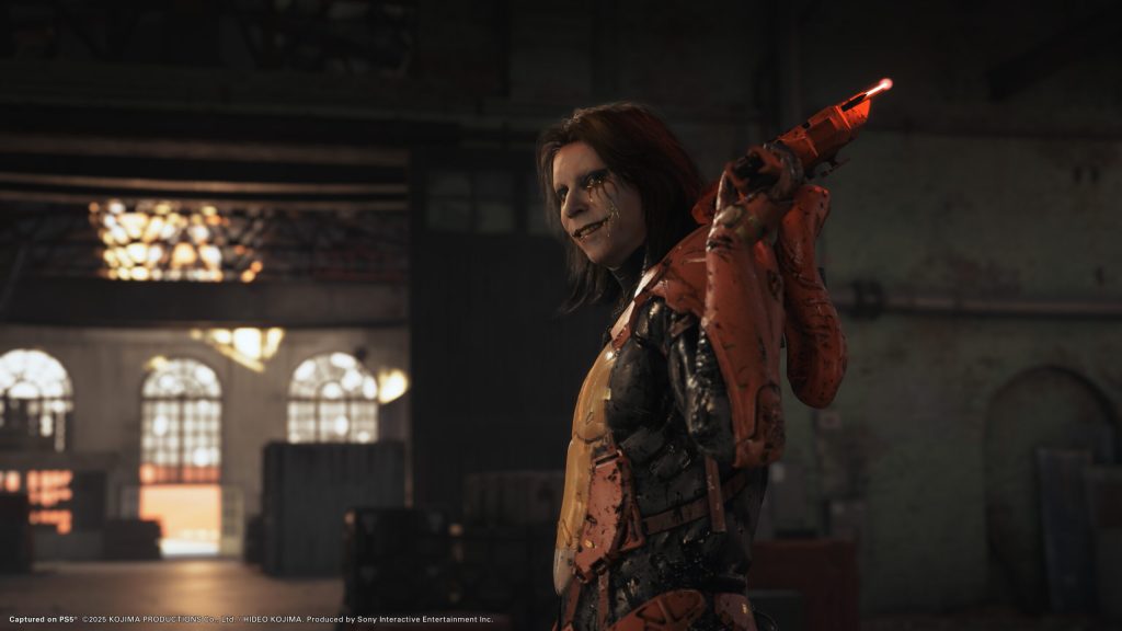 A man in a garment holding a gun