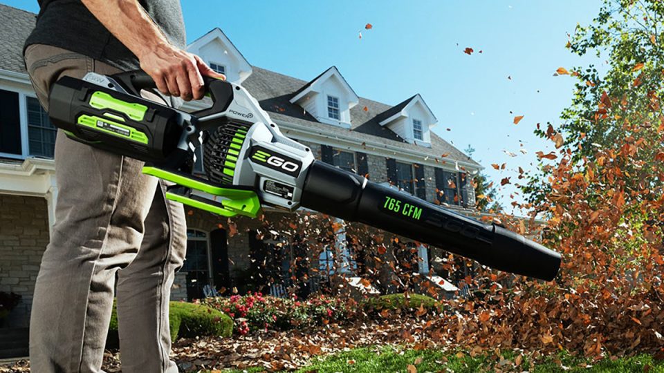A person holding a leaf blower
