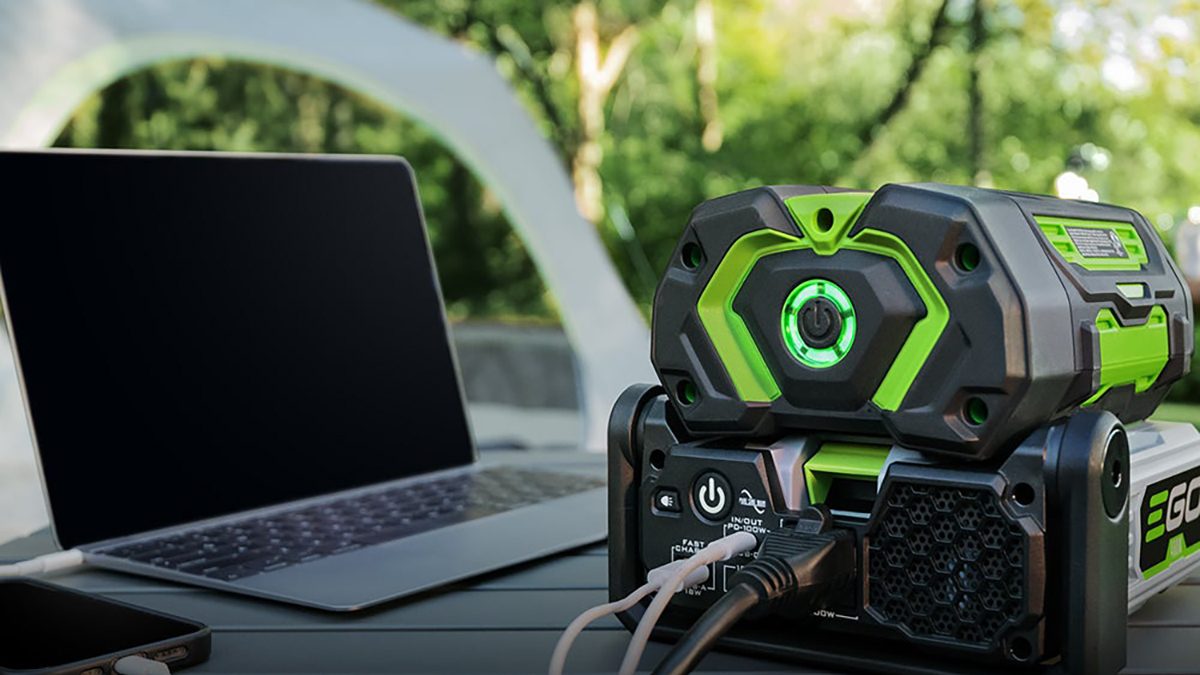 A black and green device with a laptop