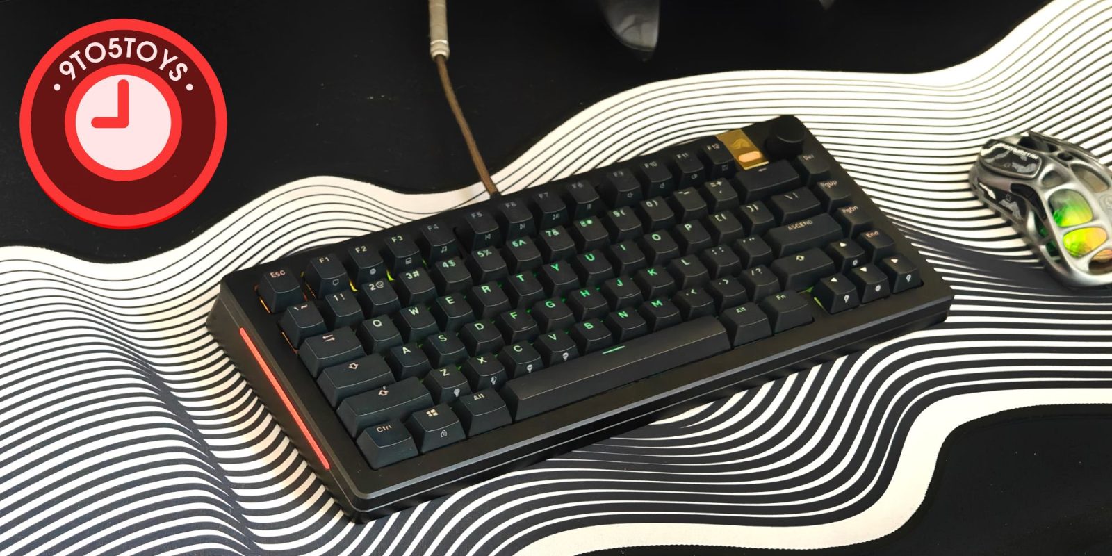 A black keyboard on a black and white striped surface