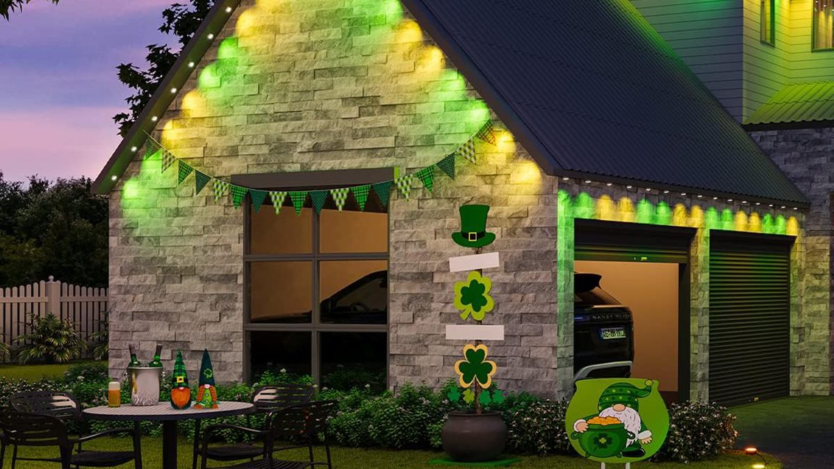 A house with a garage and a table and chairs