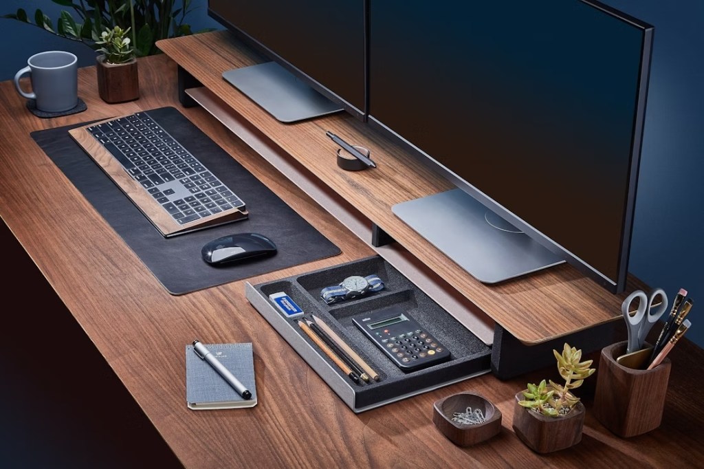 A desk with a computer and a keyboard