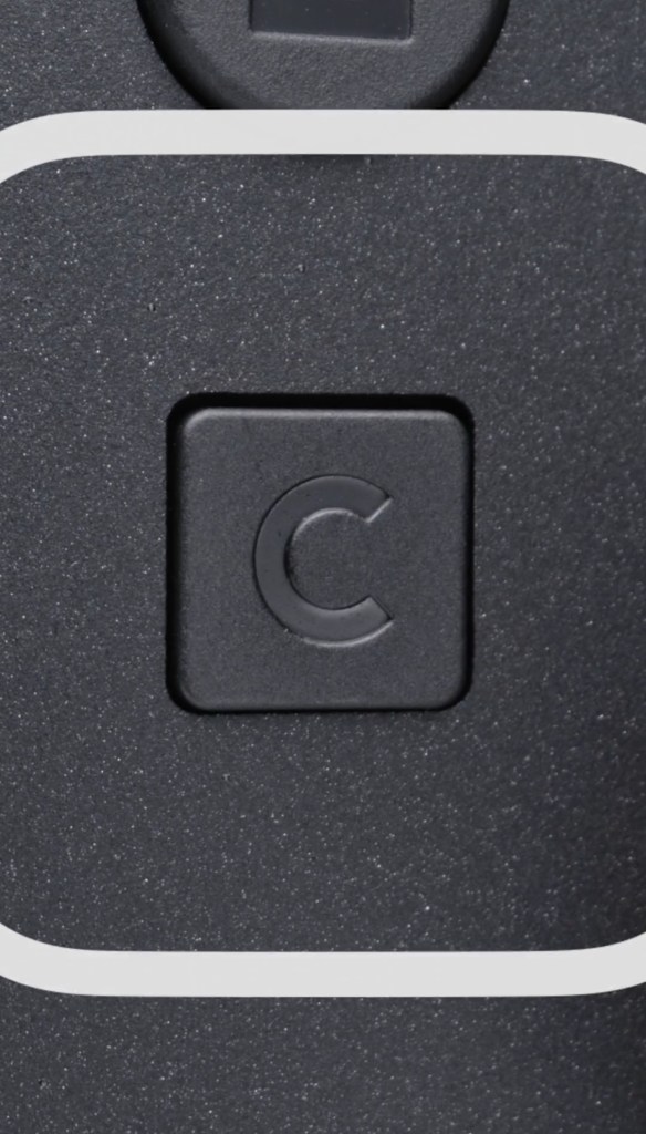 A square black button with a letter c