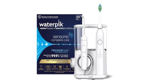 A white electric toothbrush and box