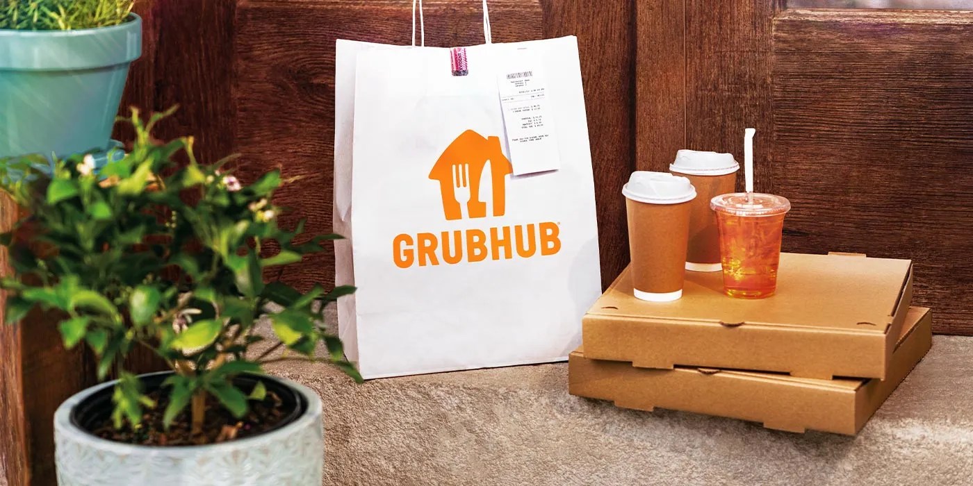 A bag and pizza boxes and a plant