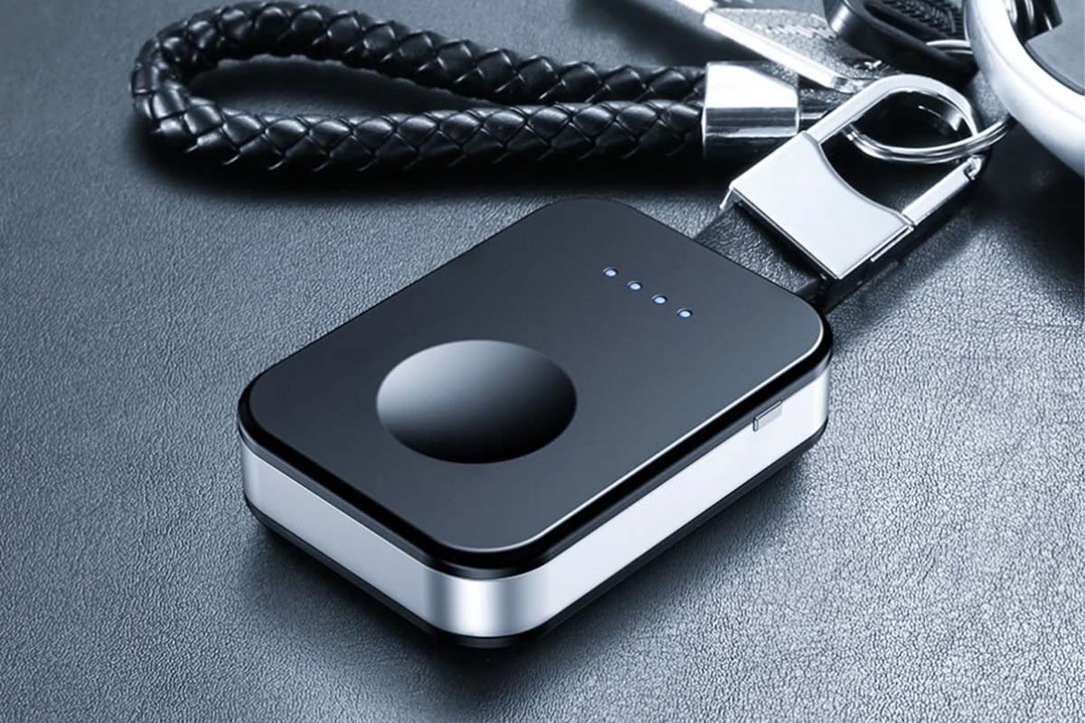 A black and silver rectangular object with a black cord