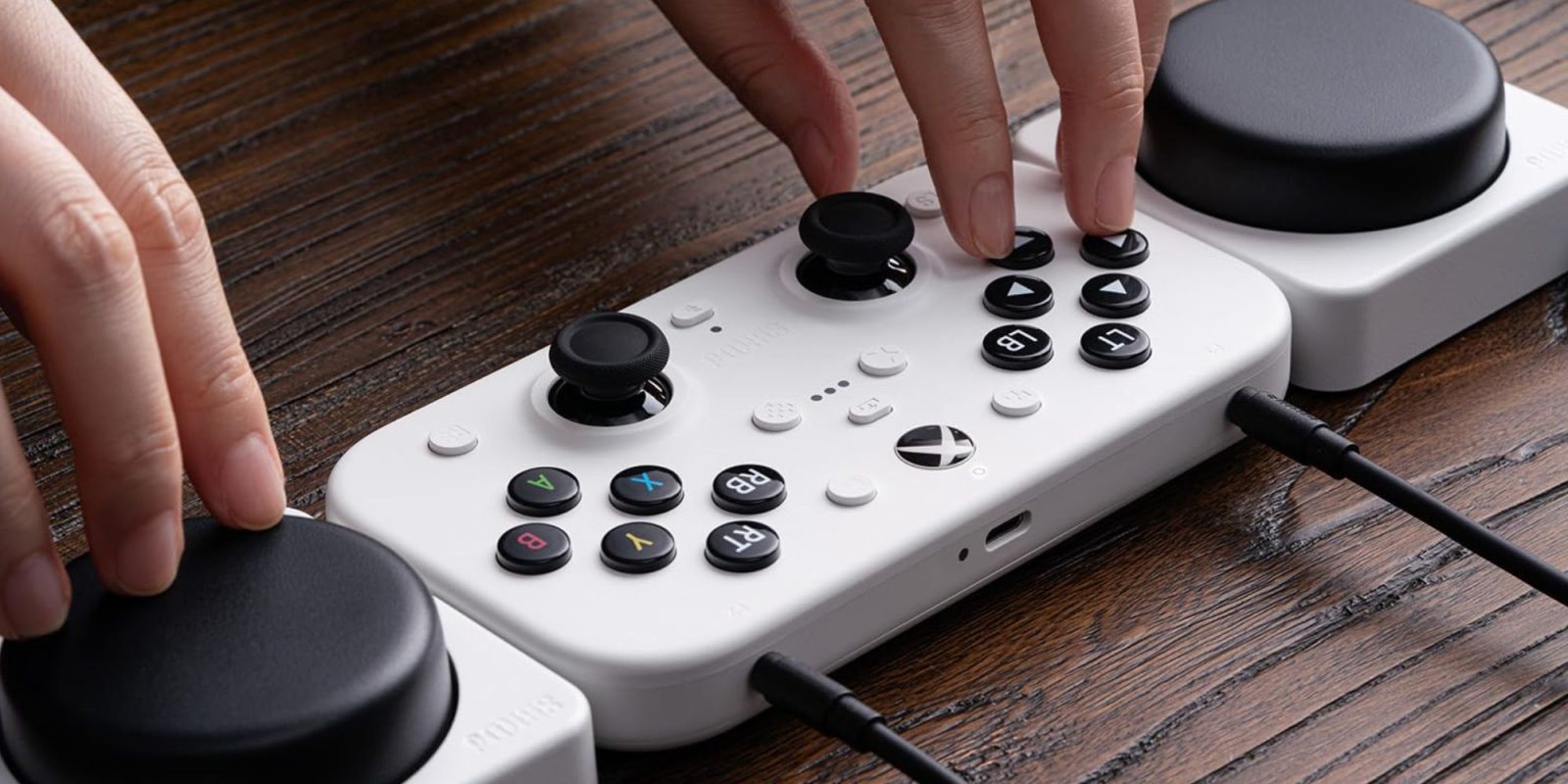 Image showing a person using 8Bitdo's Lite SE controller.