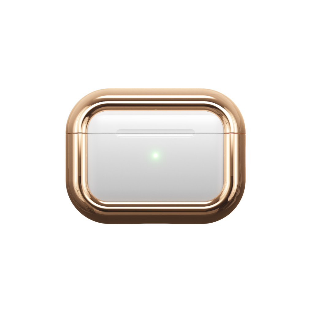 A gold and white device with a green light