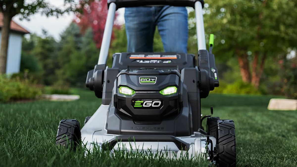 A person walking on a lawnmower