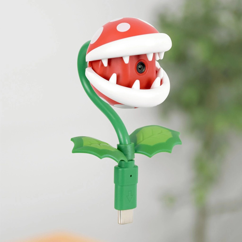 A red and white toy plant with a green stem