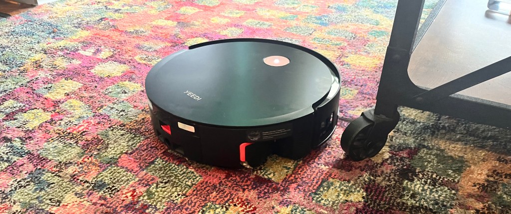 Yeedi S14 Plus robot vacuum on a colorful carpet