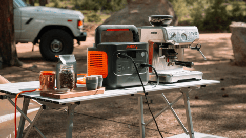 A coffee machine and coffee grinder on a table