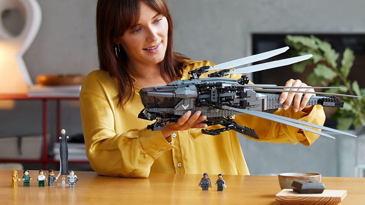 A woman holding a toy helicopter