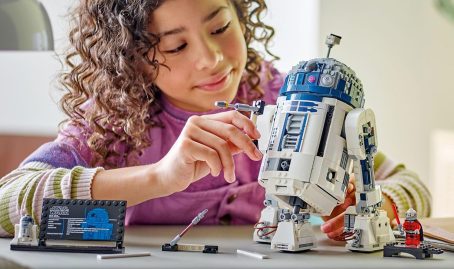 A girl building a robot