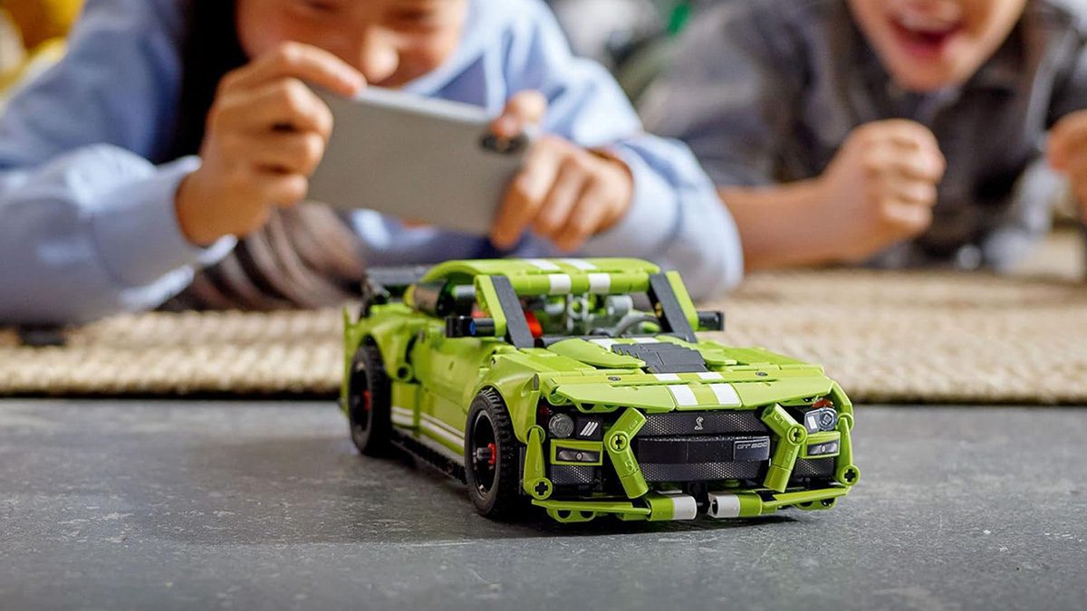 A child playing with a toy car