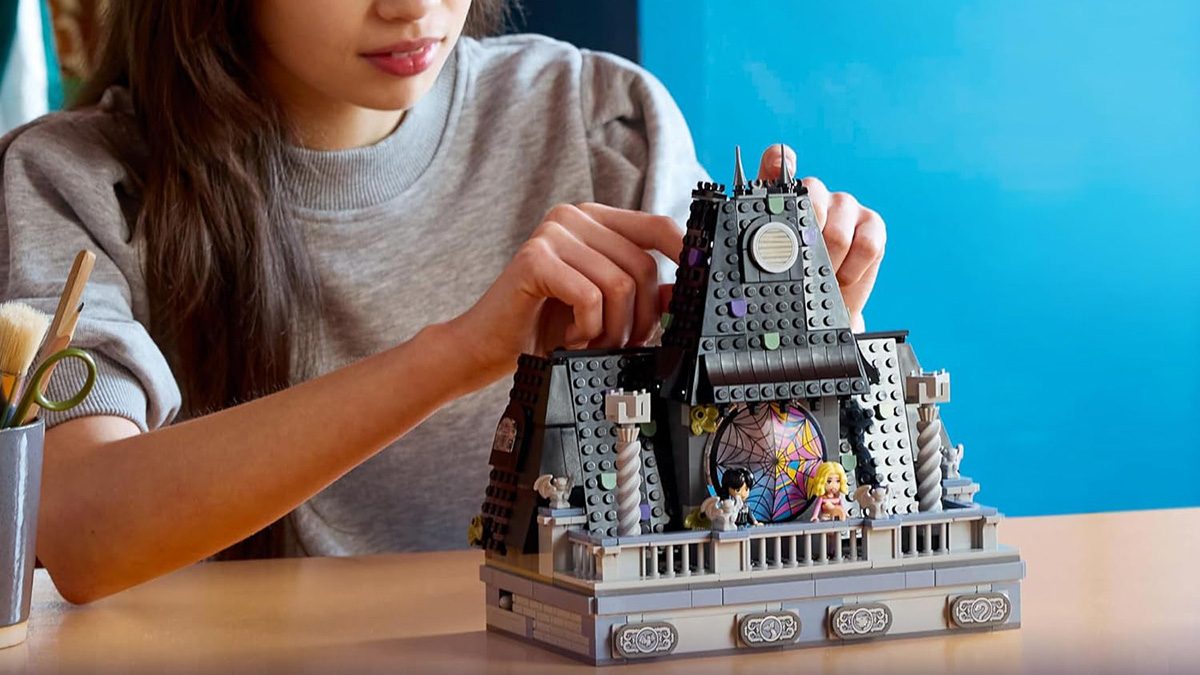 A girl playing with a building block