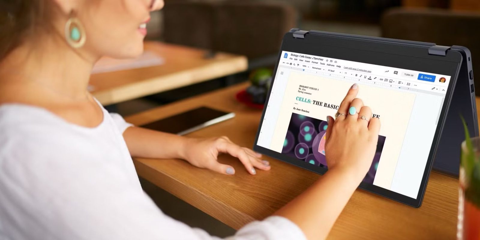 Image showing a person using Lenovo's touchscreen Chromebook Flex 3i.
