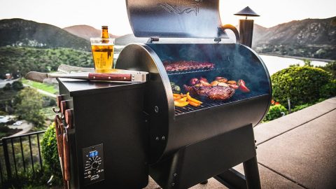 A grill with meat and vegetables on it
