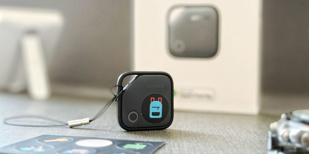 A black square device with a cord