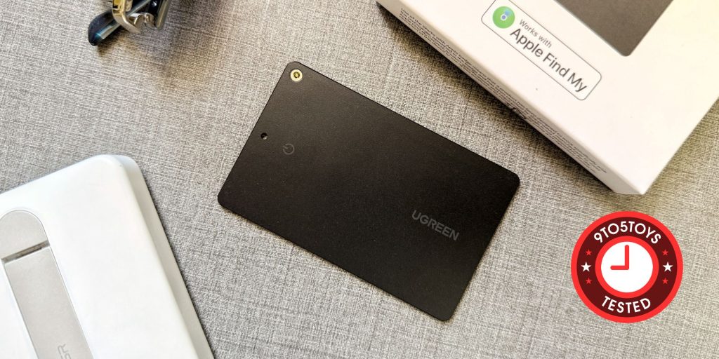 A rectangular black object on a grey surface