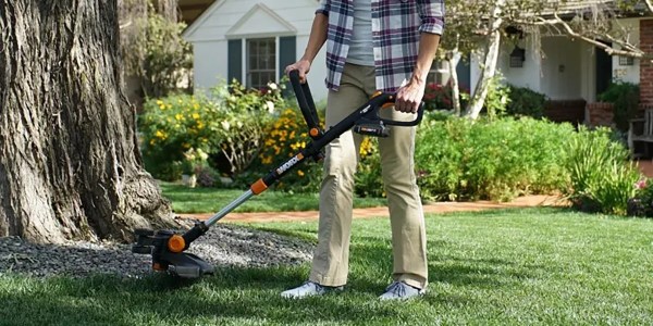 A person using a lawn mower