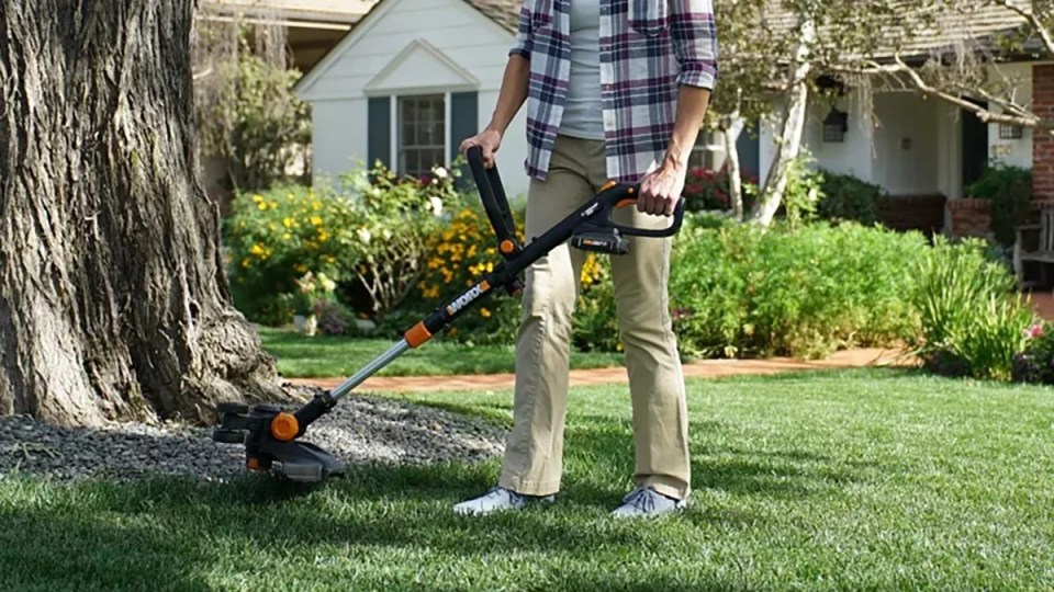 A person using a lawn mower