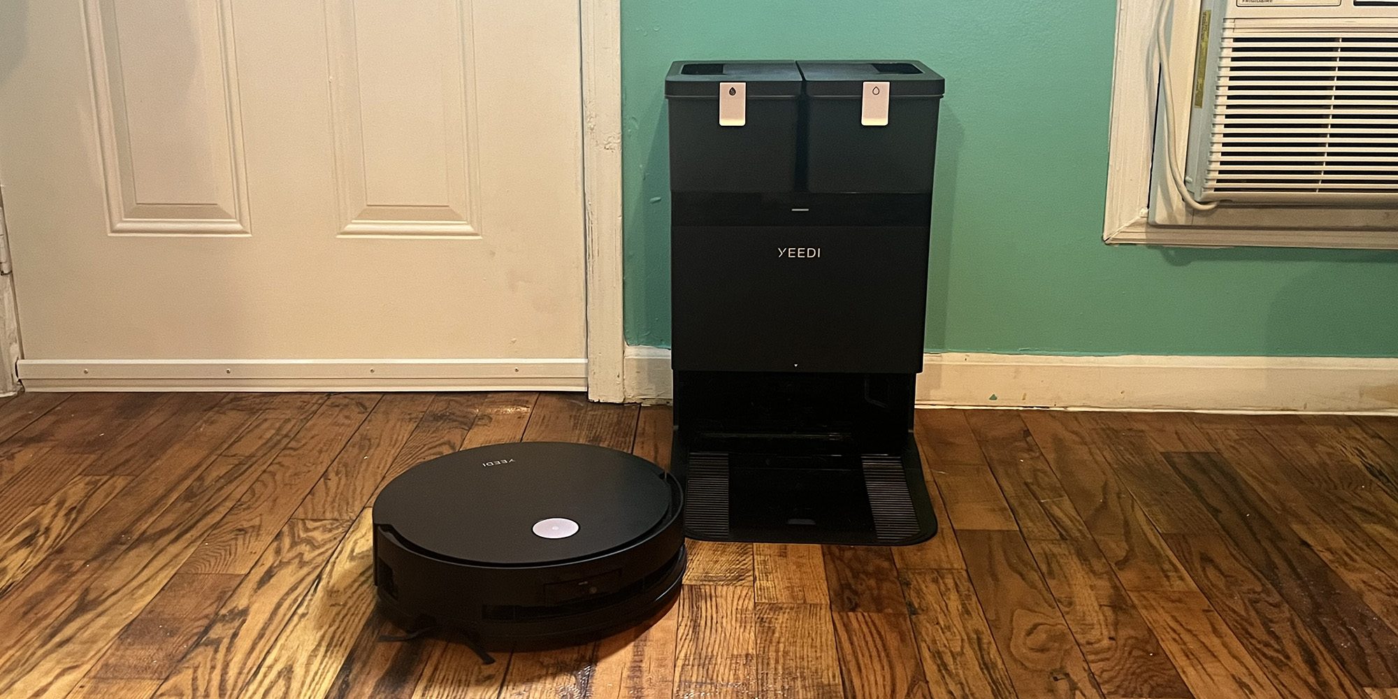 A robot vacuum cleaner on a wood floor