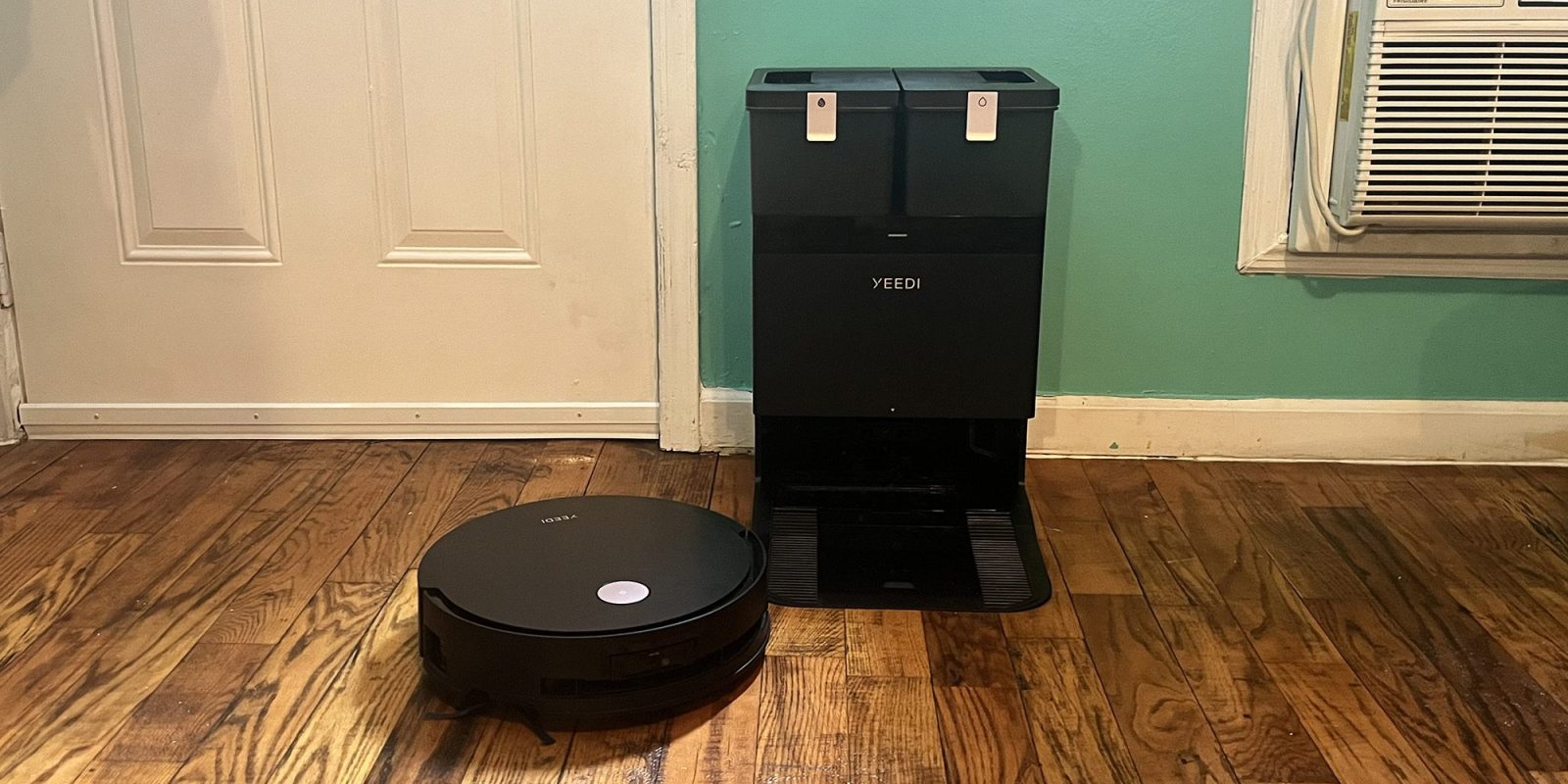 A robot vacuum cleaner on a wood floor