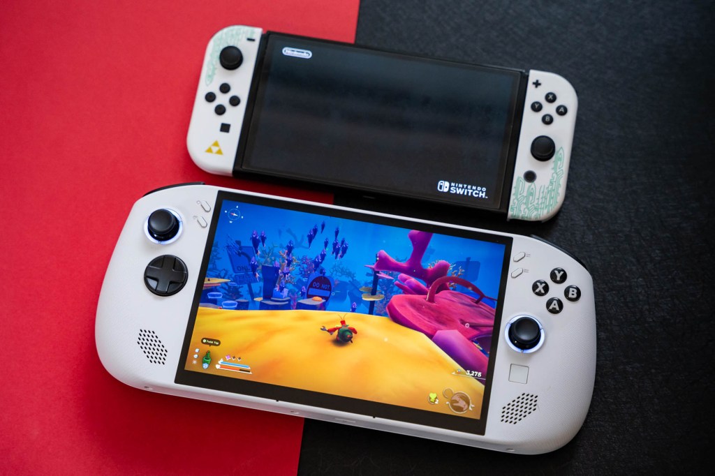 A two gaming devices on a red and black surface