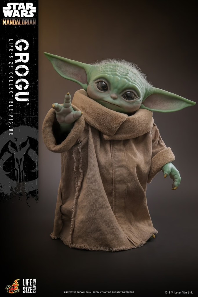 A toy figure of a baby yoda