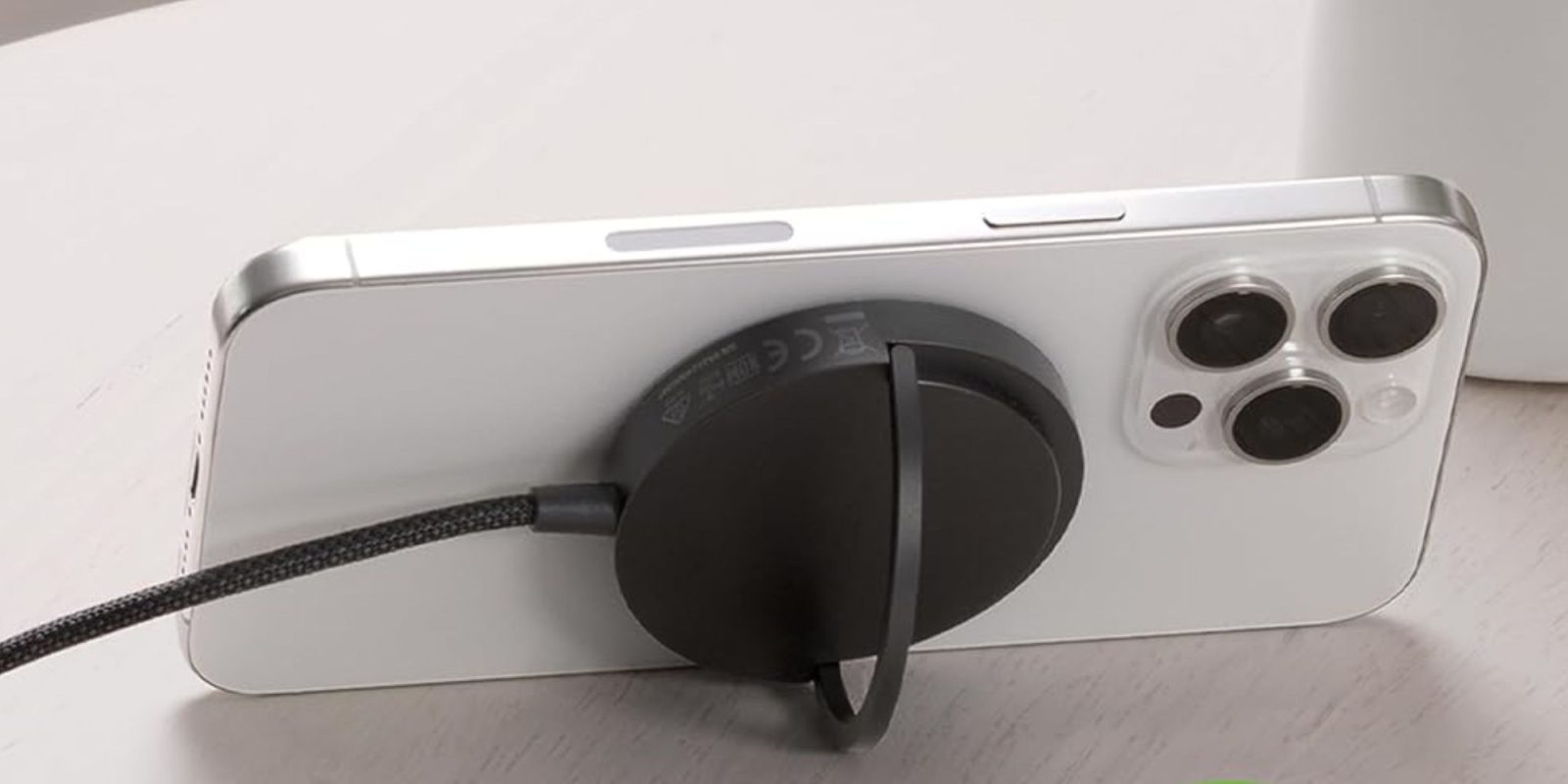 Image showing mophie's 15W Qi2 MagSafe charger powering an iPhone.